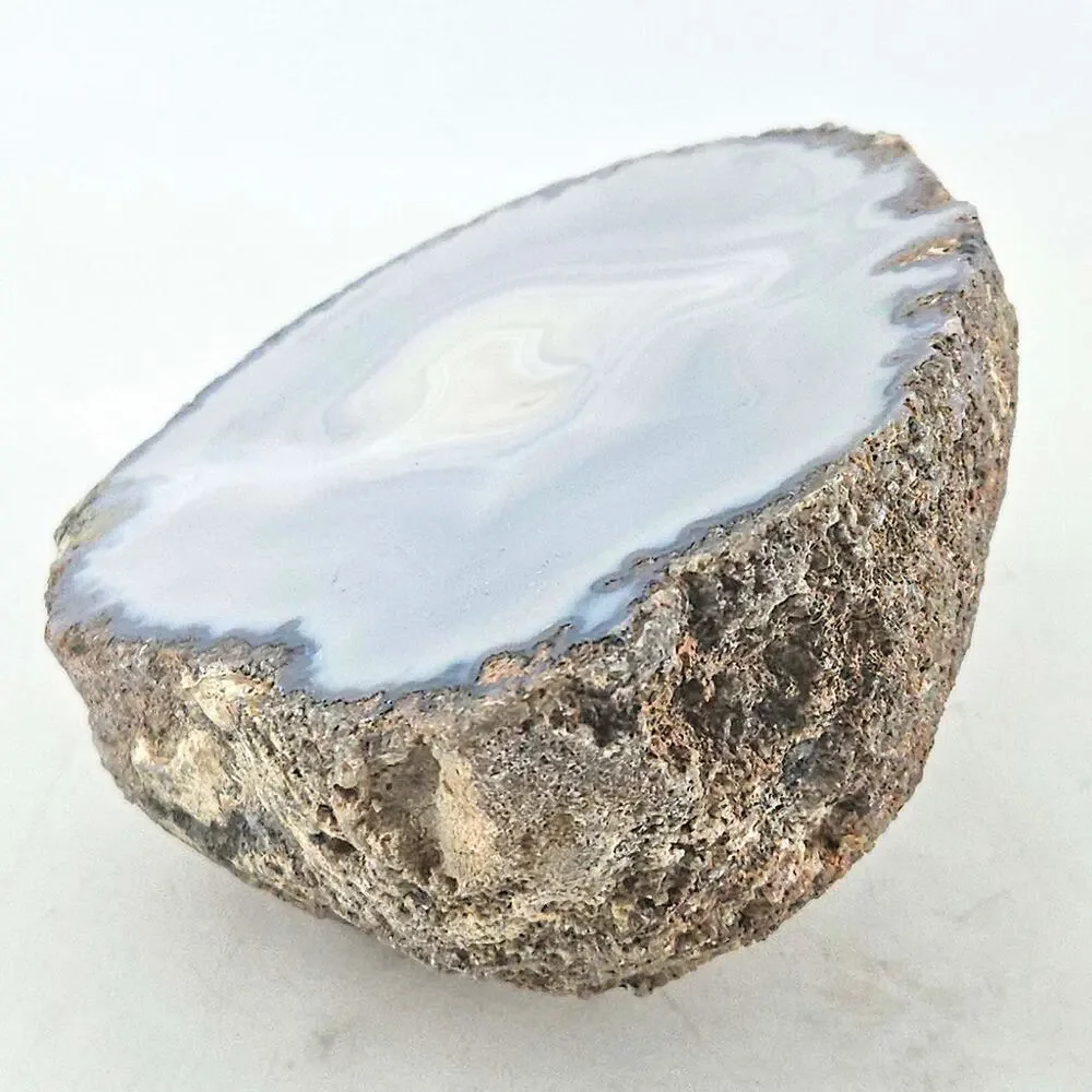 Raw Brazilian polished translucent blue grey agate geode